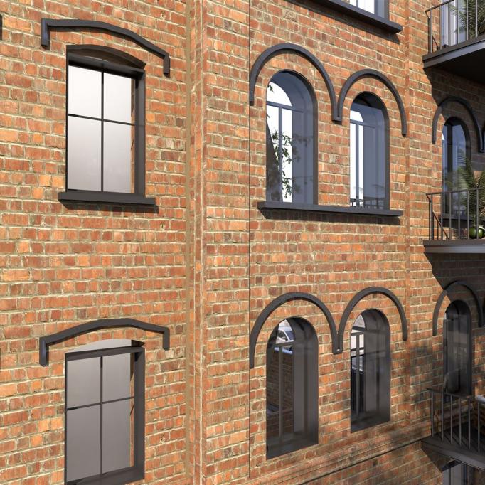 Fassade eines mehrstöckigen Gebäudes aus rotem Backstein mit verschiedenen Fenstern und Balkonen.